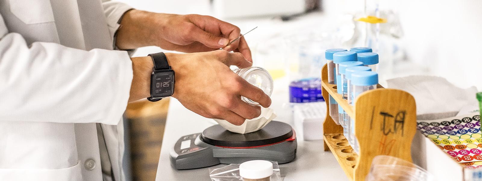 student is using medical technology equipment in a lab